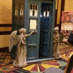 gallifrey one doctor who angel cosplay junior angels around phone box at secondgeekhood